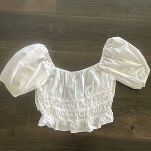 white puffy sleeved open back blouse